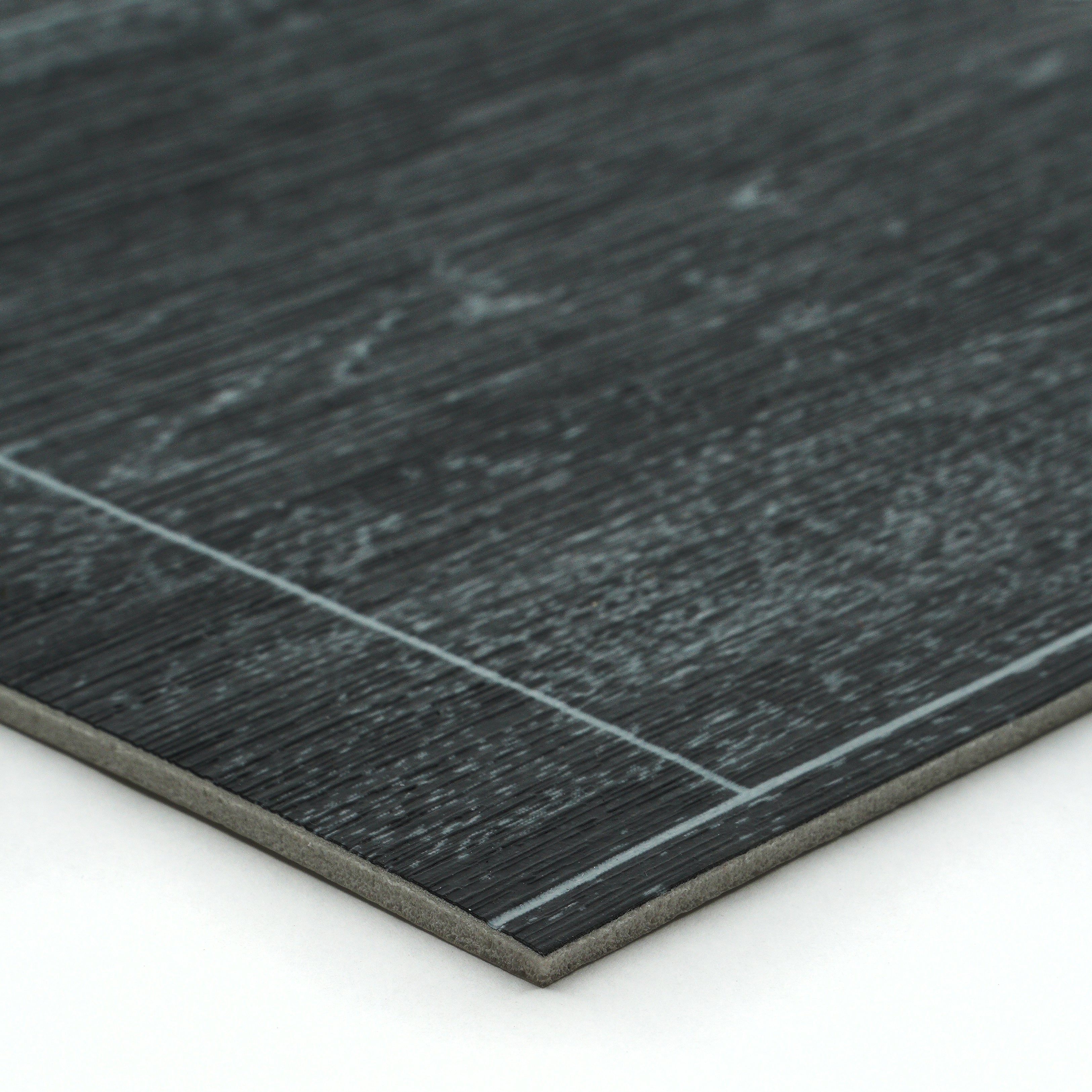 Dark gray laminate flooring with textured wood finish and smooth edge, ideal for modern interiors.
